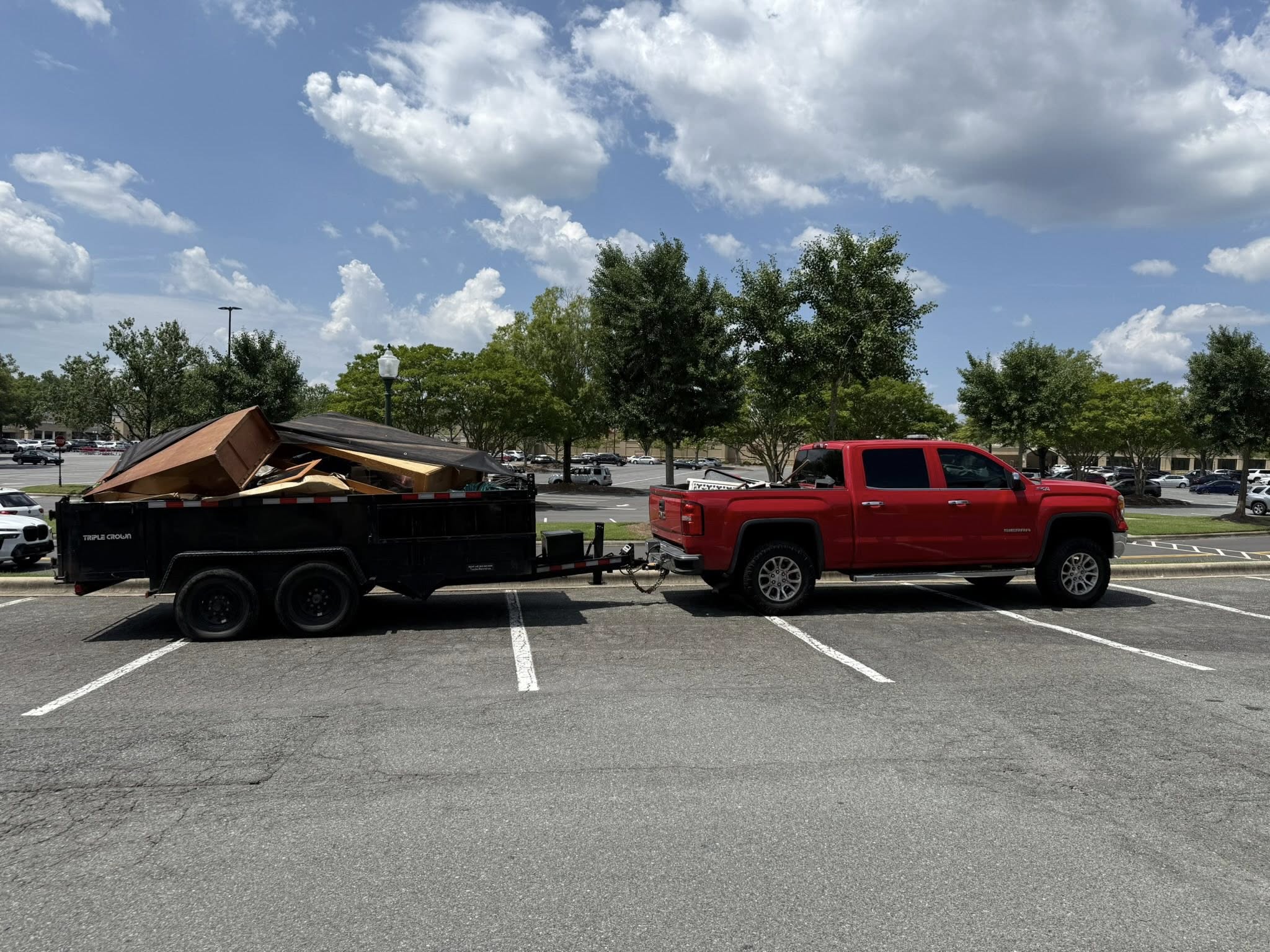 Kennedy's red GMC truck with loaded dump trailer